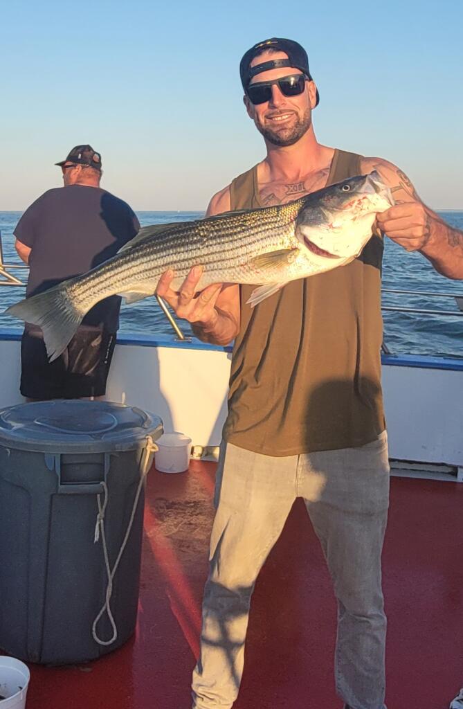 a man holding a fish