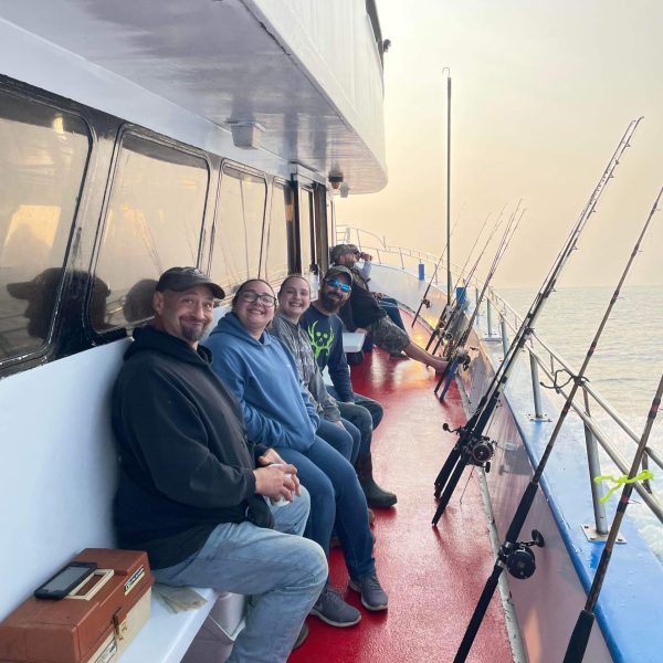 a man standing next to a boat
