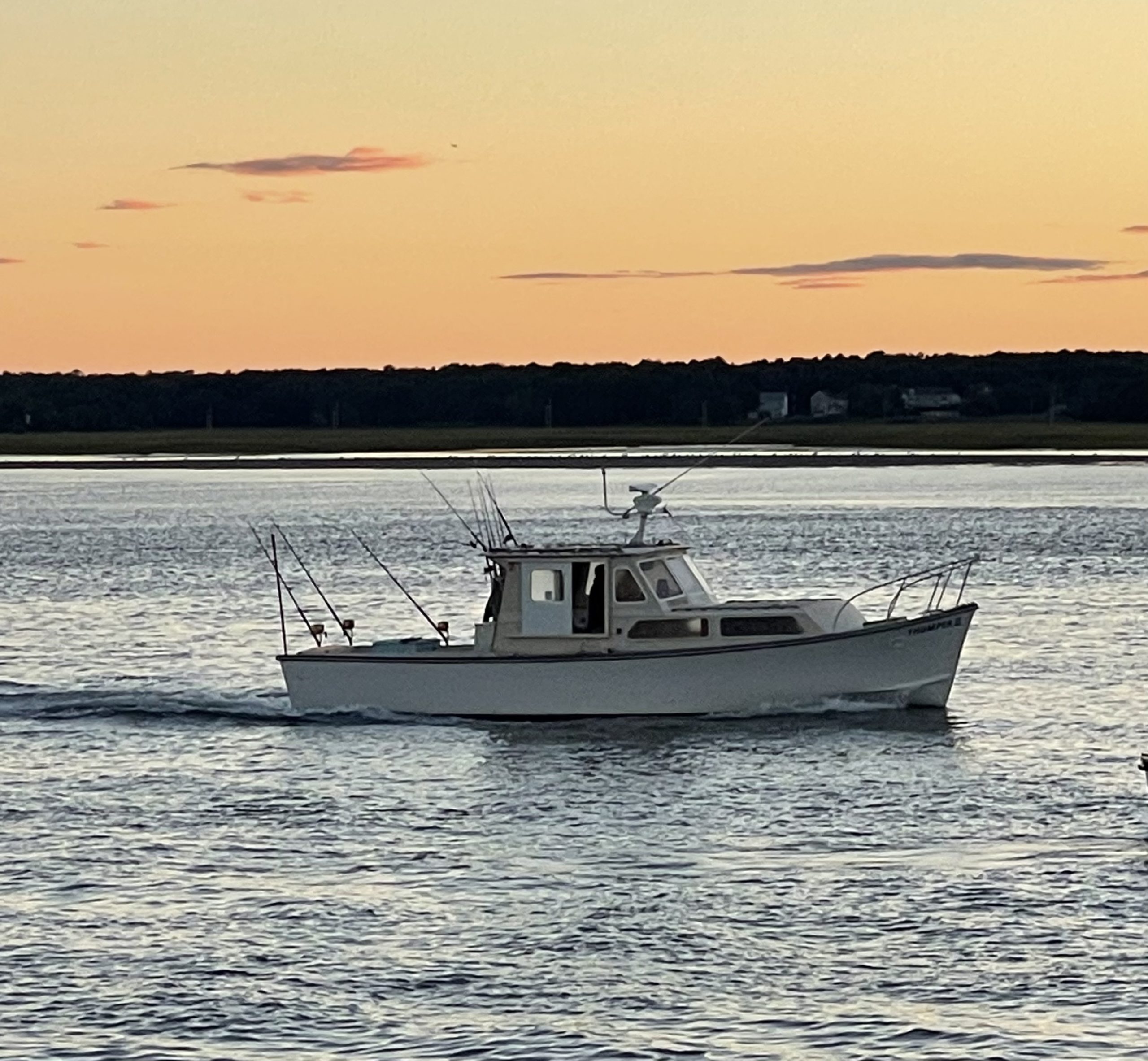 a close up of a boat next to a body of water