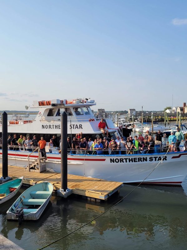 a boat is docked next to a body of water