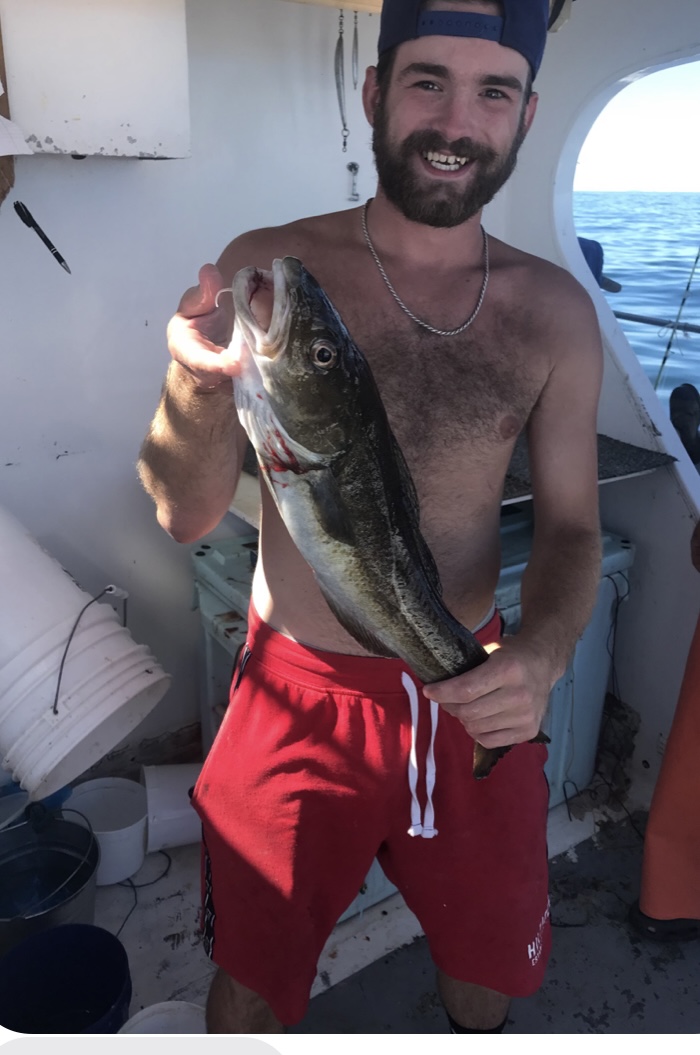 a man holding a fish