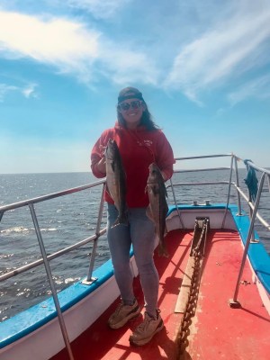 a person standing on a boat in the water
