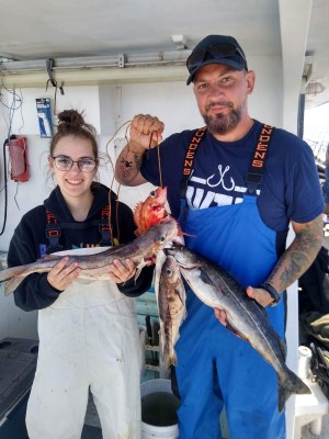 a person holding a fish