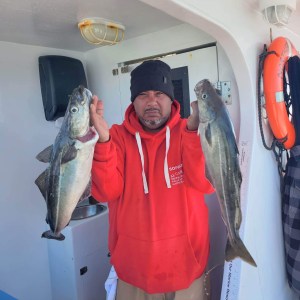 a man holding a fish