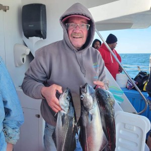 a man holding a fish