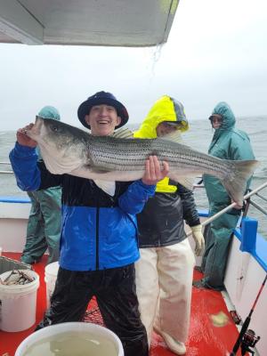a person holding a fish