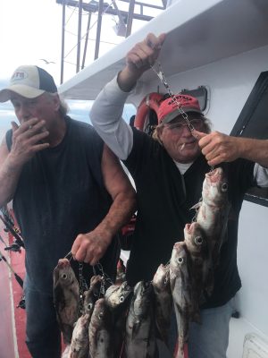 a man holding a fish