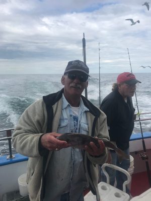 a man holding a fish