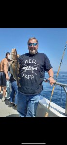 a man holding a fish