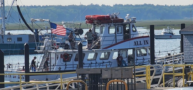 a boat docked at a dock