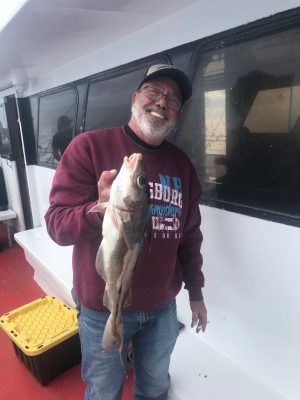 a man holding a fish