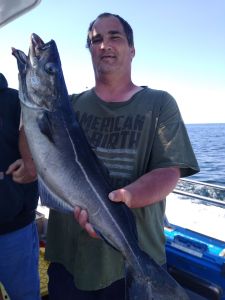 a man holding a fish