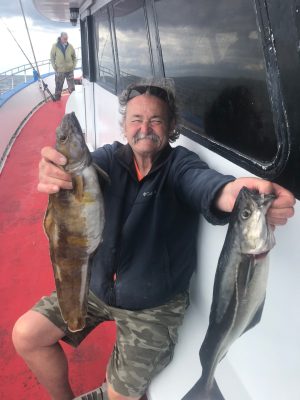 a person holding a fish