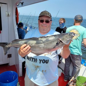 a person holding a fish