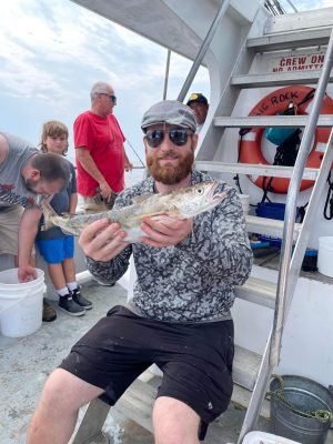 a person holding a fish