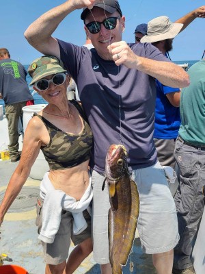 a man holding a fish