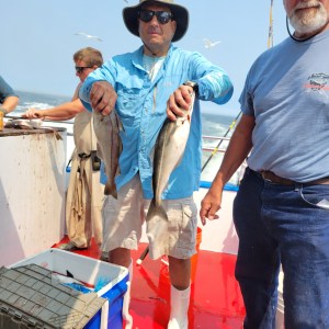 a person holding a fish