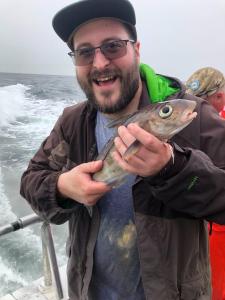 a man holding a fish