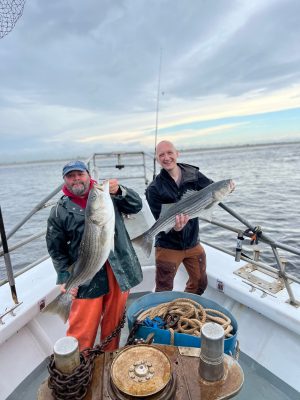 a person holding a fish in the water