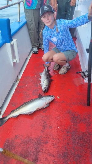 a person holding a fish
