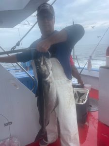 a man holding a fish