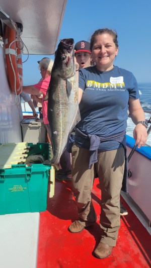 a person holding a fish