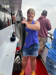 a person holding a fish