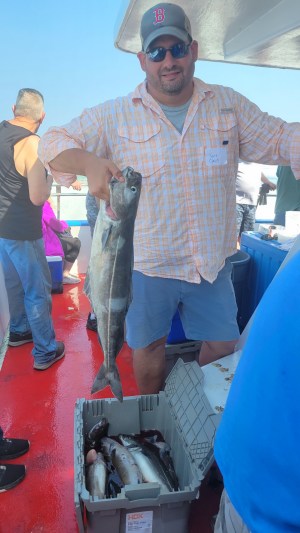 a man holding a fish