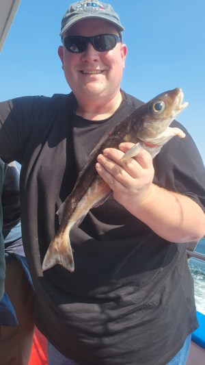 a person holding a fish