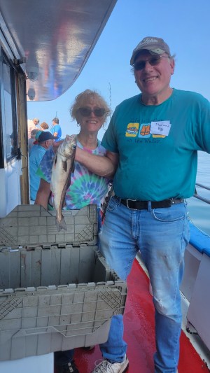 a man holding a fish