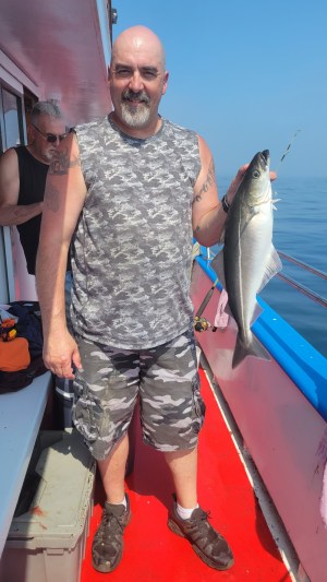 a man holding a fish
