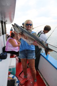 a person holding a fish