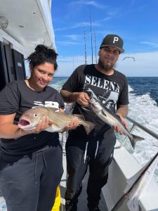 a person holding a fish