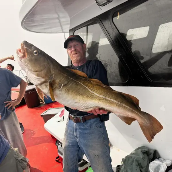 a man holding a fish