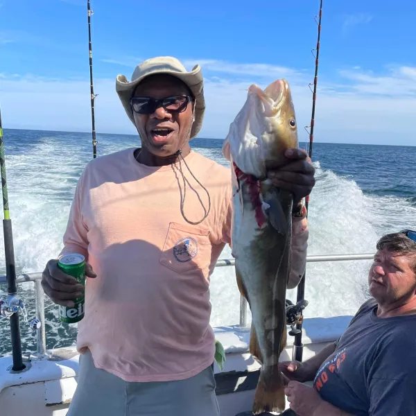 a person holding a fish in the water