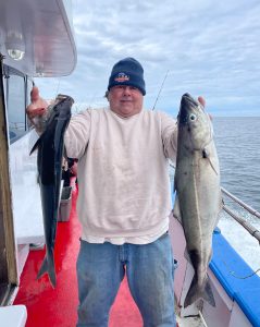 a man holding a fish