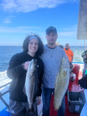 a man holding a fish in the water