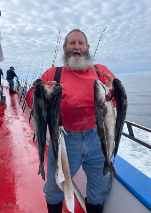 a person holding a fish in the water