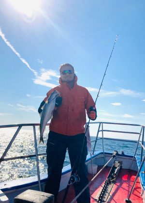 a man that is standing in the snow