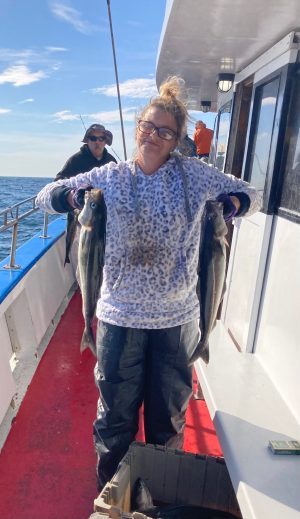 a man holding a fish