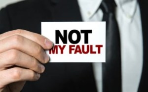 a hand holding up a sign