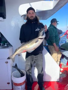 a person holding a fish
