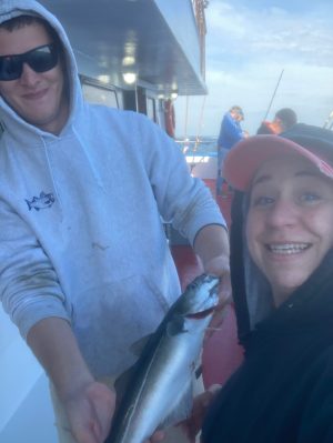 a person holding a fish