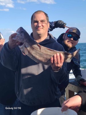 a person holding a fish