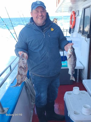 a man holding a fish