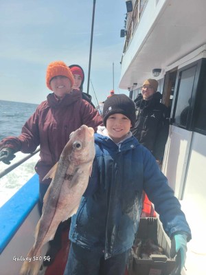 a man holding a fish