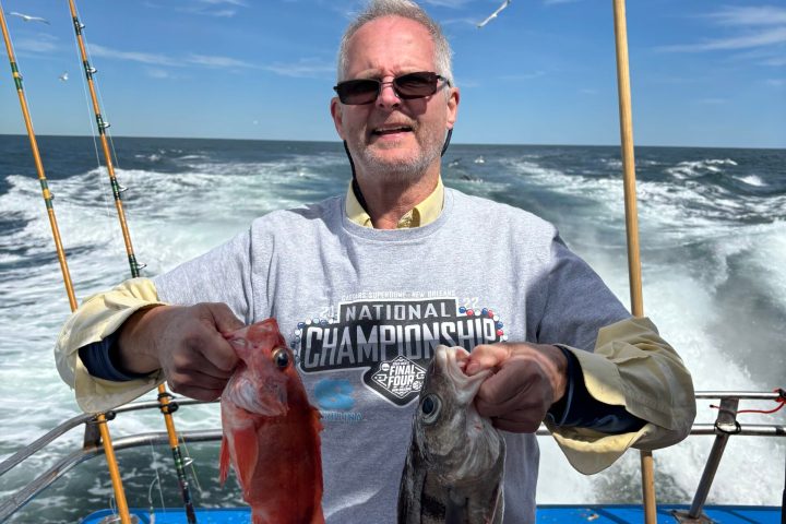 a man holding a fish