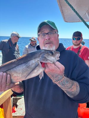 a person holding a fish