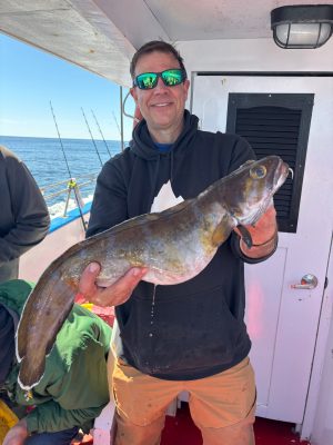 a person holding a fish