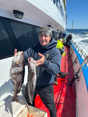 a person holding a fish